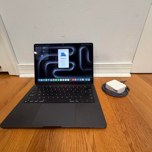 Space Black M3 Pro MacBook Pro photographed for the MKL-Tech Facebook Marketplace listing